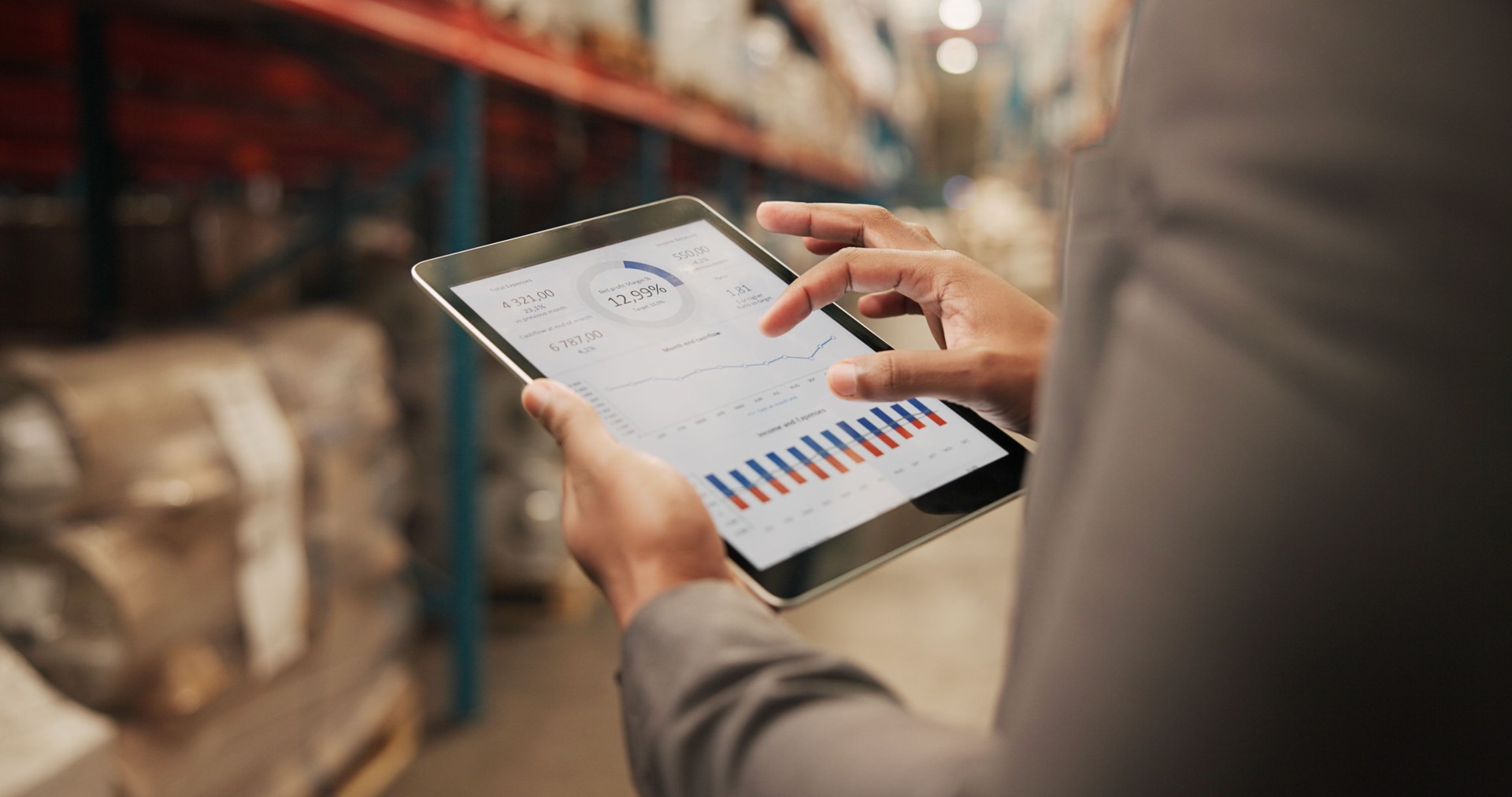 Business person, hands or logistics with tablet screen for analytics, graph or chart data at storage warehouse. Closeup, distributor or analyst with technology for inventory revenue or stock exchange